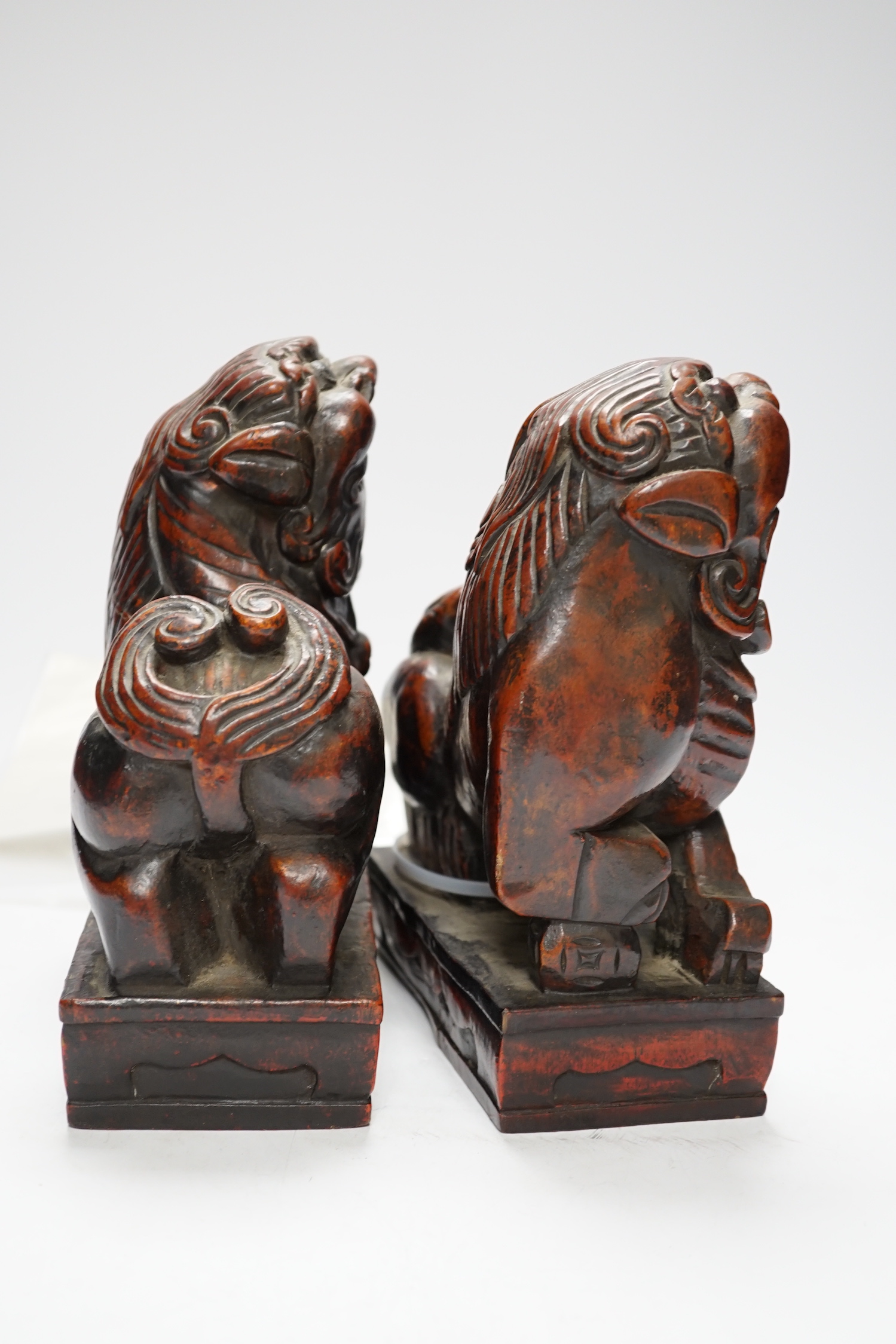 Two Japanese carved and lacquered hardwood Temple dogs, late Tokugawa period, 16cm wide